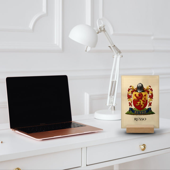 Personalized coat of arms desk plaque on oak stand on a home office desk